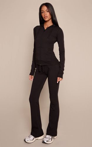 Pantalon Évasé Skinny Taille Basse Pour Grandes Tailles | Taille 36 - PrettyLittleThing - Modalova