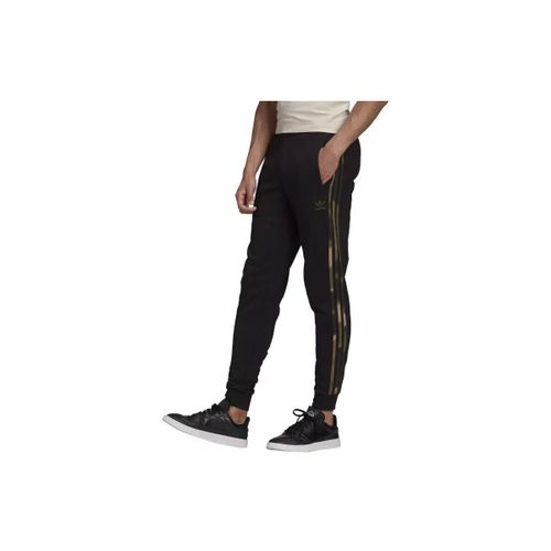Jogging adidas Homme CAMO STRIPES - adidas - Modalova