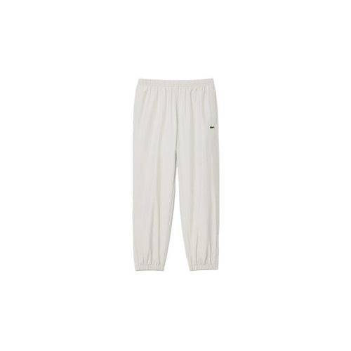 Pantalon PANTALON DE SURVÊTEMENT EN TISSU DÉPERLANT GRIS - Lacoste - Modalova