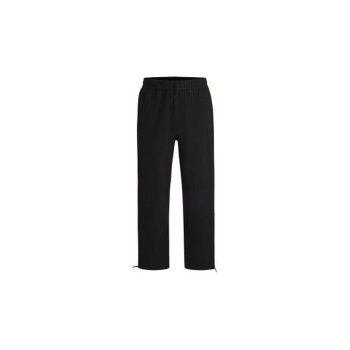 Pantalon PANTALON CARGO NOIR REGULAR FIT EN RIPSTOP STRETCH DÉPERLANT - HUGO - Modalova