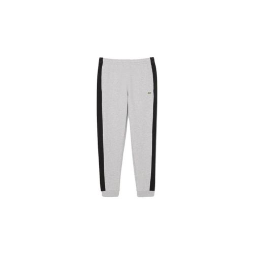 Pantalon PANTALON DE SURVÊTEMENT FUSELÉ COLOR-BLOCK NOIR ET G - Lacoste - Modalova