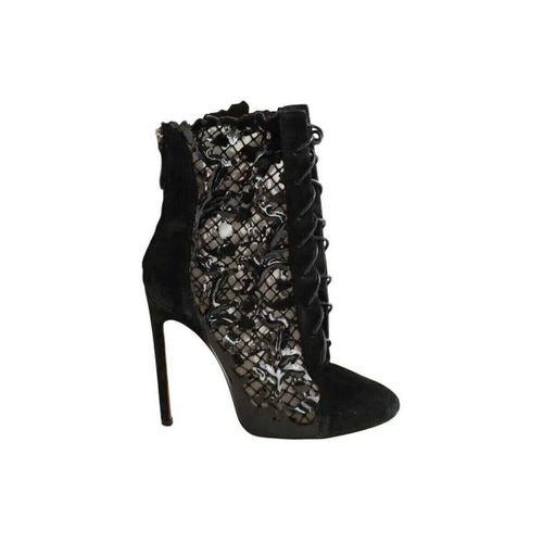 Bottines Boots à lacets en daim noires - Alaia - Modalova