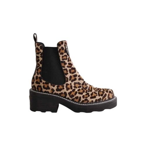 Boots Louis Vuitton Boots beige - Louis Vuitton - Modalova