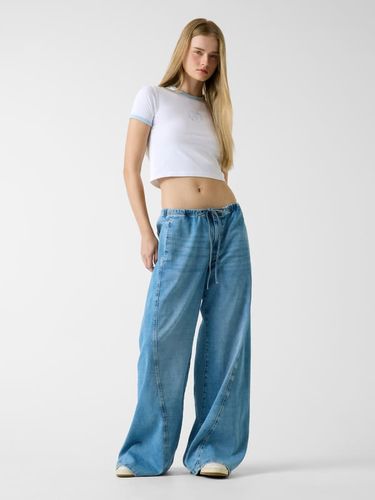 Jean Jogger Taille Basse Extra-Larges À Jambe Torsadée - Guess - Modalova