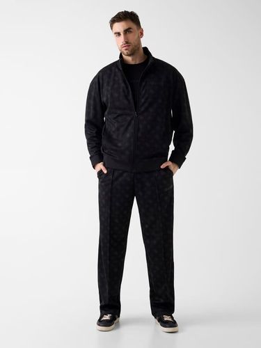 Pantalons De Survêtement Avec Logo Partout - Guess - Modalova