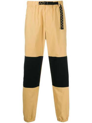 pantalon nike brun