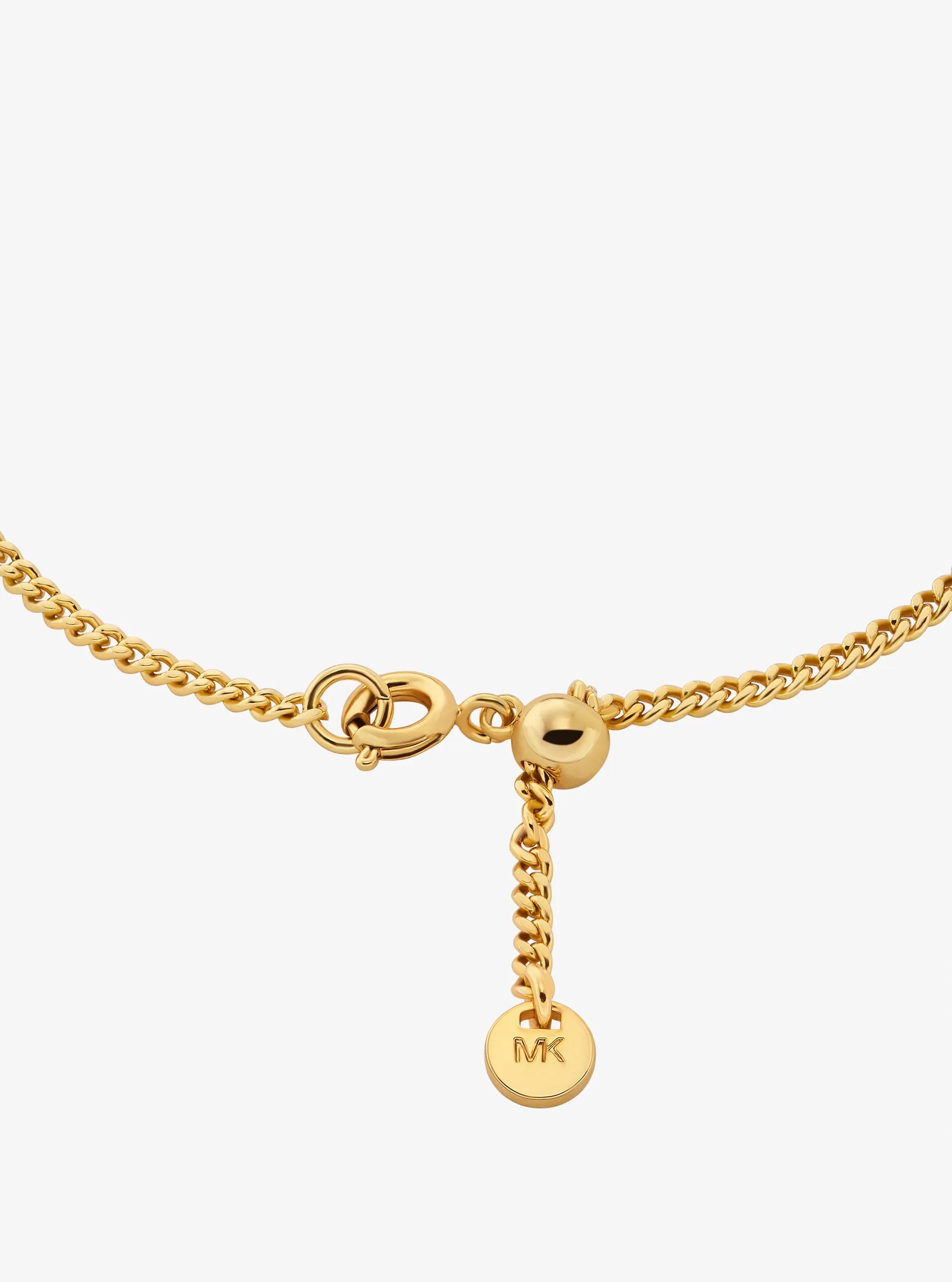 MK Bracelet à glissière bicolore avec breloque à pierres pavées et logo - Michael Kors - Modalova